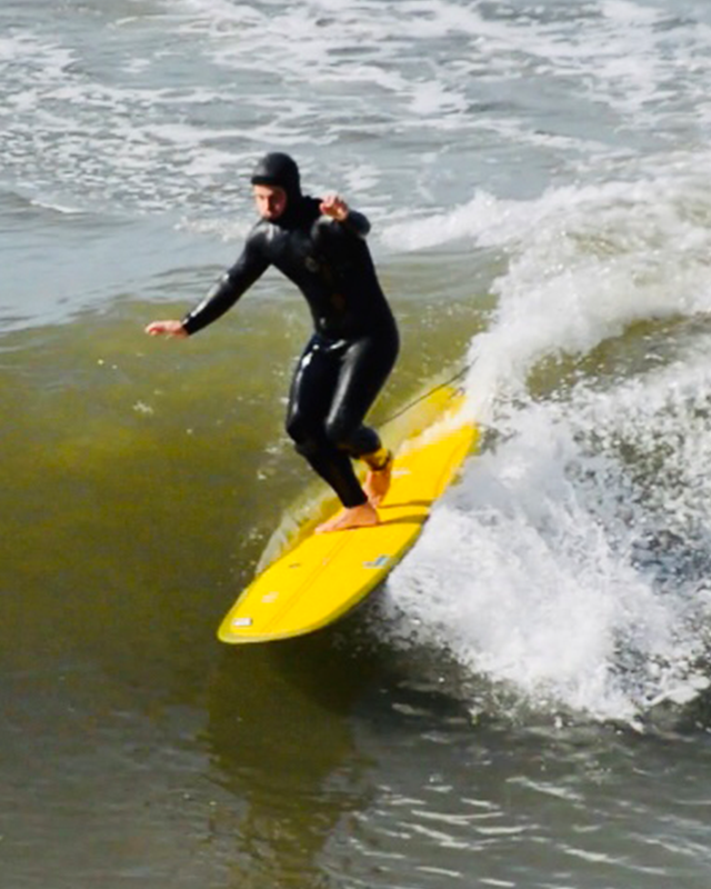 Walking in a longboard surf