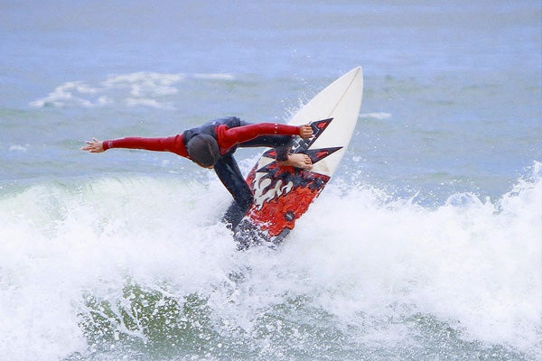 kid surfing with van der waal surf grip